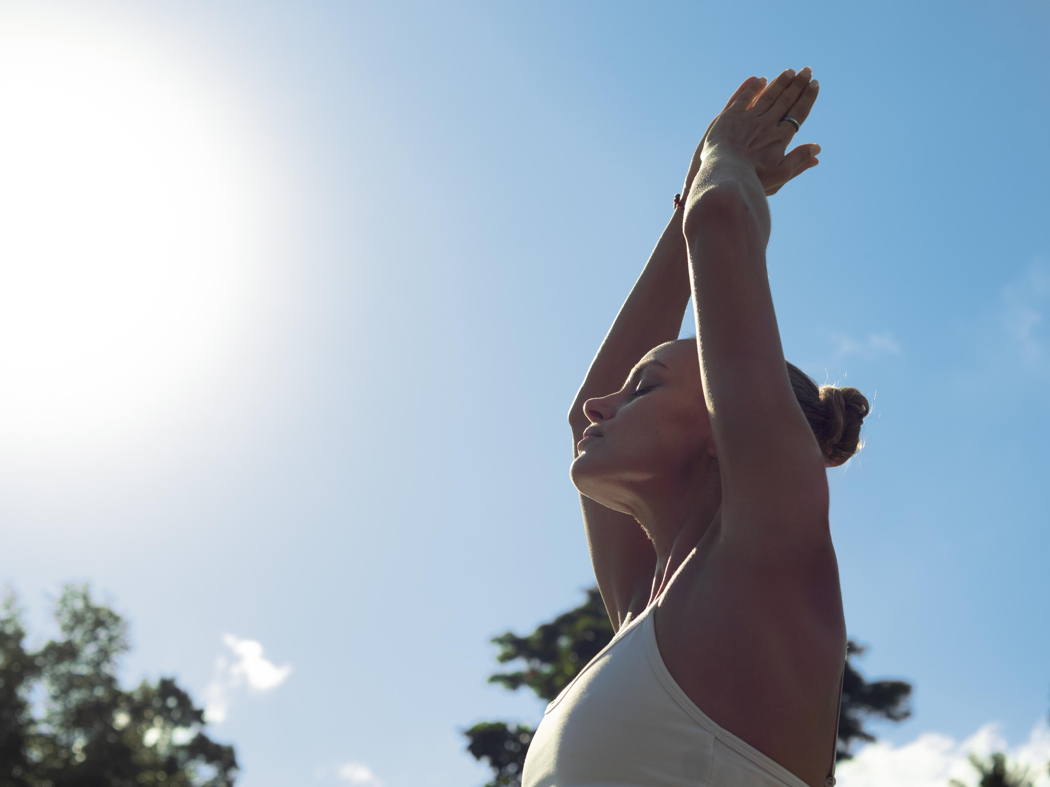 Adiwana Suweta Hotell Ubud Exteriör bild A woman practicing yoga